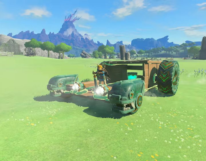 Link rides a vehicle he constructed in The Legend of Zelda: Tears of the Kingdom.