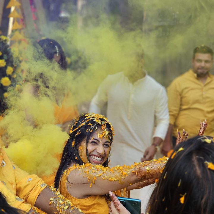 Indian bride grinning and dancing captured with the Samsung Galaxy S23 Ultra’s 3x telephoto portrait mode camera.