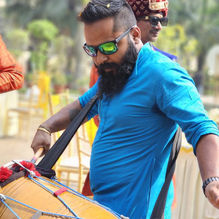 Man playing an Indian drum captured with the Samsung Galaxy S23 Ultra’s 3x telephoto portrait mode camera.