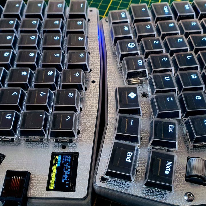 PolyKybd, a split keyboard with OLED screens in the keycaps.