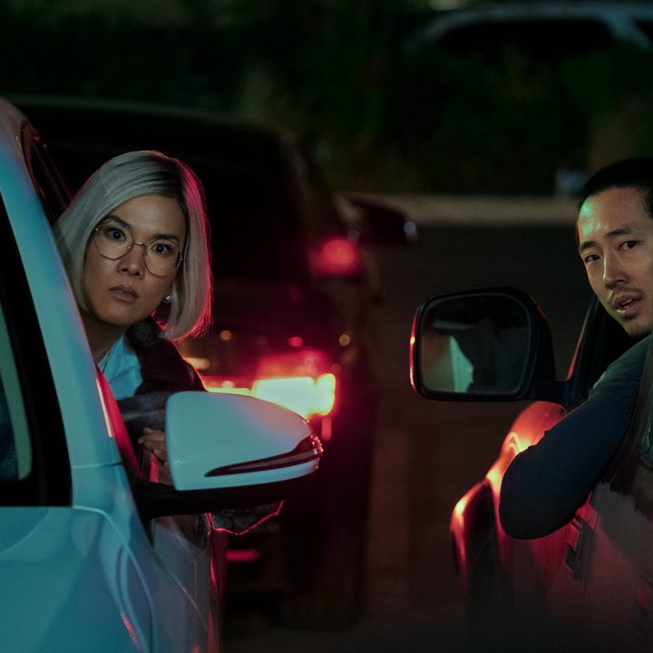 Ali Wong and Steven Yeun lean out of their car windows in Beef.