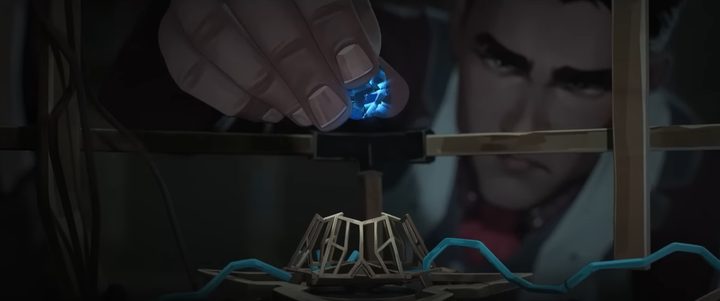 A man holding a magic crystal in "Arcane."
