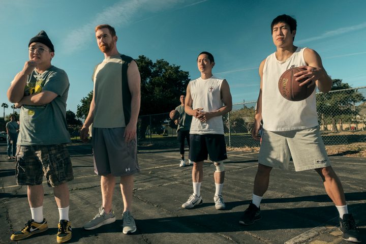Bobby, Michael, Danny, and Paul stand on a basketball court together in Beef.