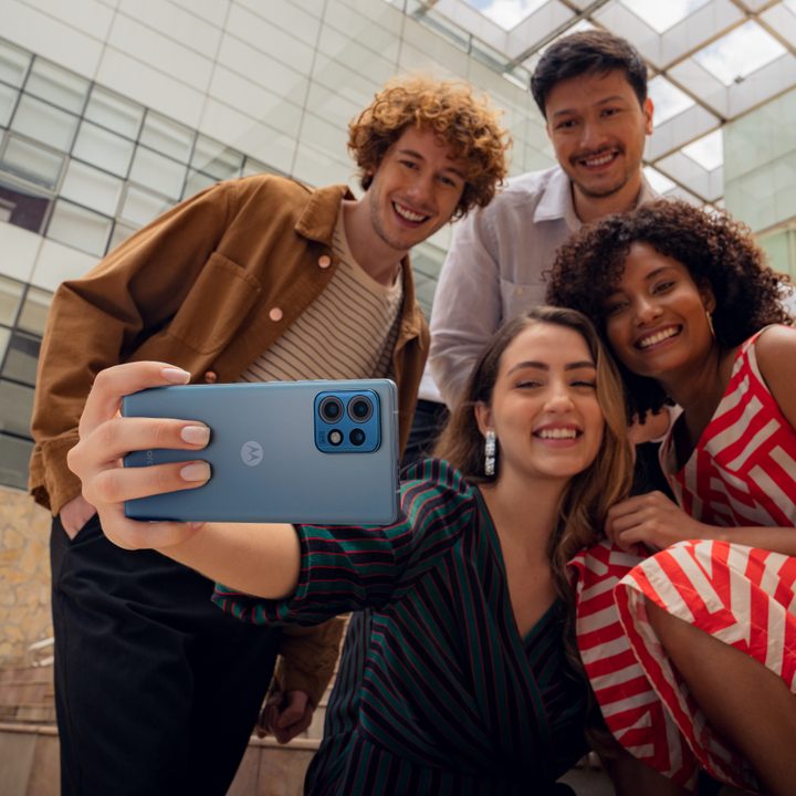 Promotional image with people taking a selfue using the Motorola Edge 40 Pro.