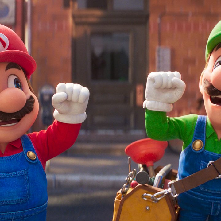 Mario and Luigi raise their fists together in The Super Mario Bros. Movie.