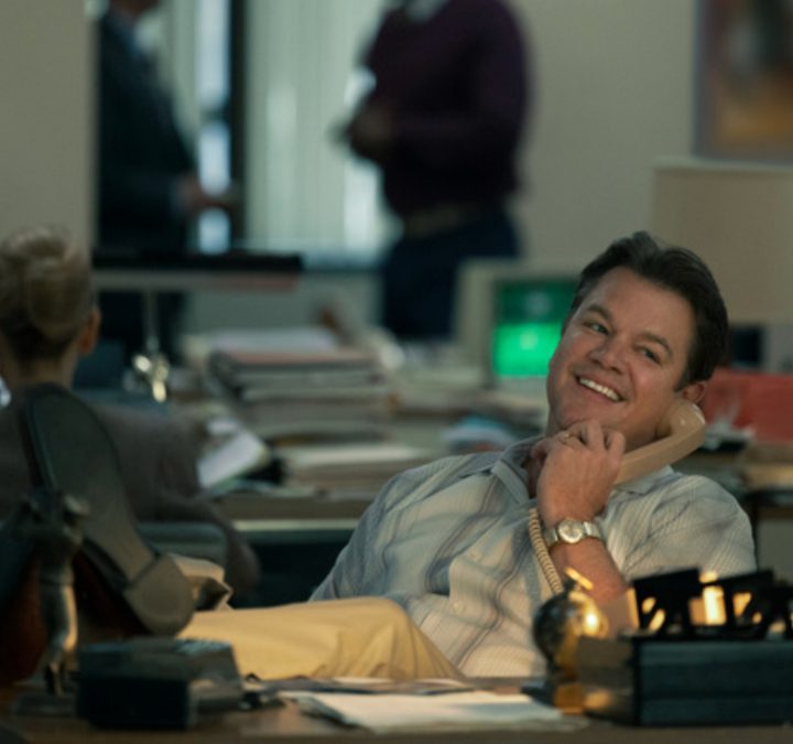 Matt Damon sits at his desk on the in Air.