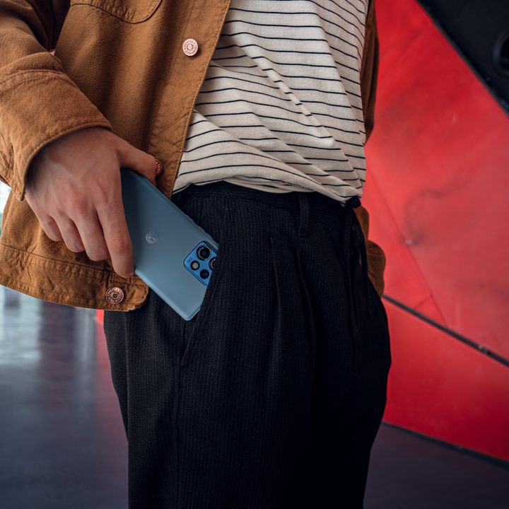 A promotional image showing a person putting the Motorola Edge 40 Pro in their pocket.