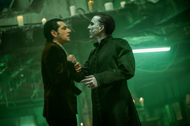 Nicolas Cage holds Ben Schwartz by the neck in Renfield.