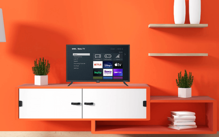 An onn. 32-inch Roku Smart TV on a cabinet in a living room.