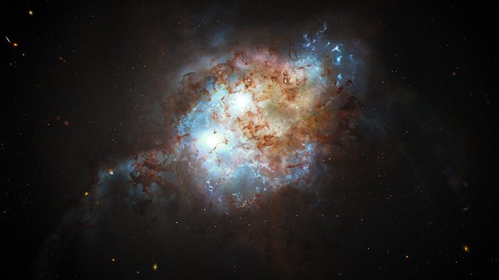 This artist's concept shows the brilliant glare of two quasars residing in the cores of two galaxies that are in the chaotic process of merging. The gravitational tug-of-war between the two galaxies ignites a firestorm of star birth.