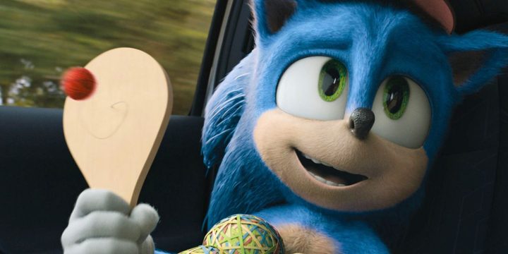 Sonic plays with a paddle in the car in Sonic the Hedgehog.