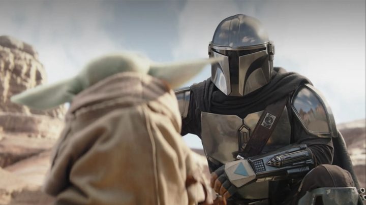 Din Djarin helping train Grogu in The Mandalorian.