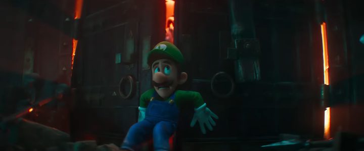 Luigi against a door as Dry Bones try to capture him in "The Super Mario Bros. Movie."