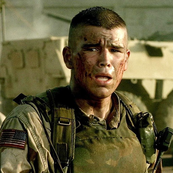 A man winces in battle in Black Hawk Down.