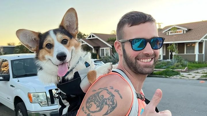 A social media photo of Ronald Gladden from Jury Duty with his dog, wearing a tank top and sunglasses.