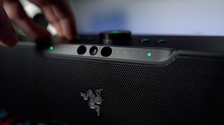 A hand controlling the Razer Levithan V2 pro.