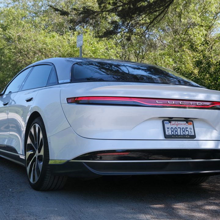 View of the rear of a Lucid Air Grand Touring in white.