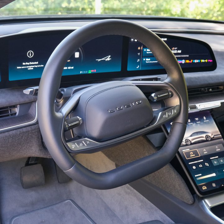 Interior view of the dash and steering wheel in a Lucid Air.