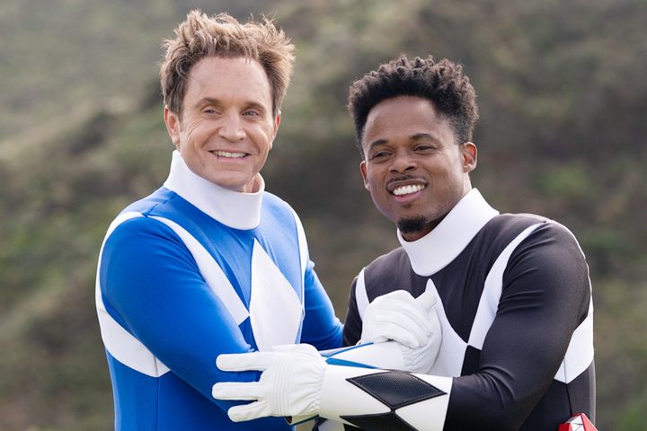 Two men lean on each other in Mighty Morphin Power Rangers: Once and Always.
