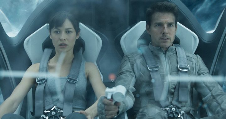 A man and a woman fly in a space ship in Oblivion.