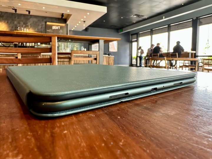 OnePlus Pad in magnetic keyboard case cover on table showing bottom of device