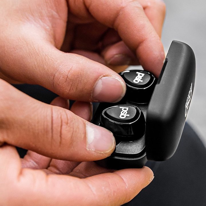 PSB M4U TWM wireless earbuds in charging case.