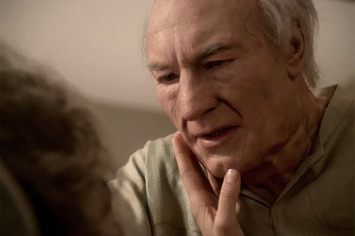 A woman touches Picard's face in Star Trek: The Next Generation.