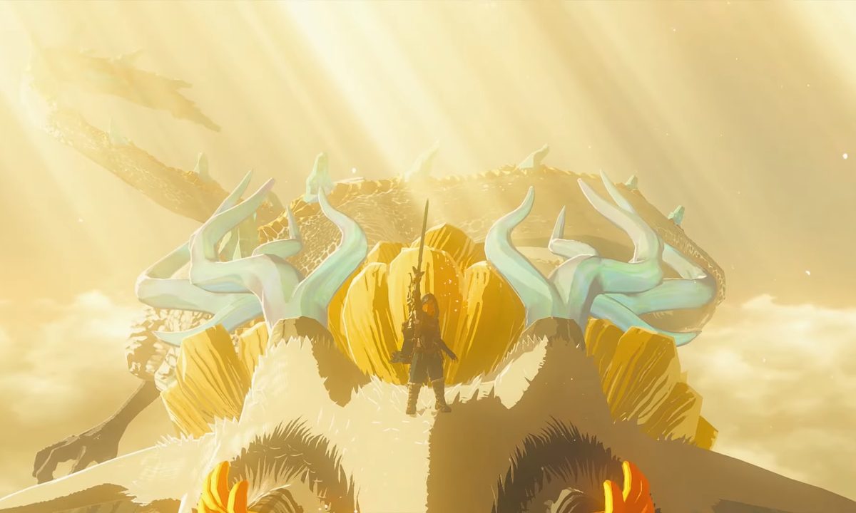 Link holds up the master sword on top of a dragon.