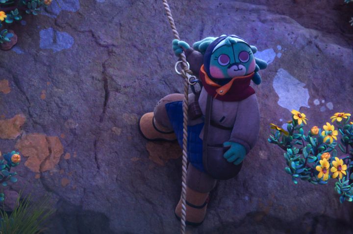 Aau hangs against the side of a rock wall in Star Wars: Visions Volume 2.