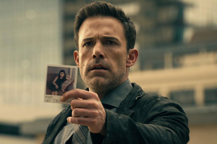 Ben Affleck holds up a photograph in Hypnotic.