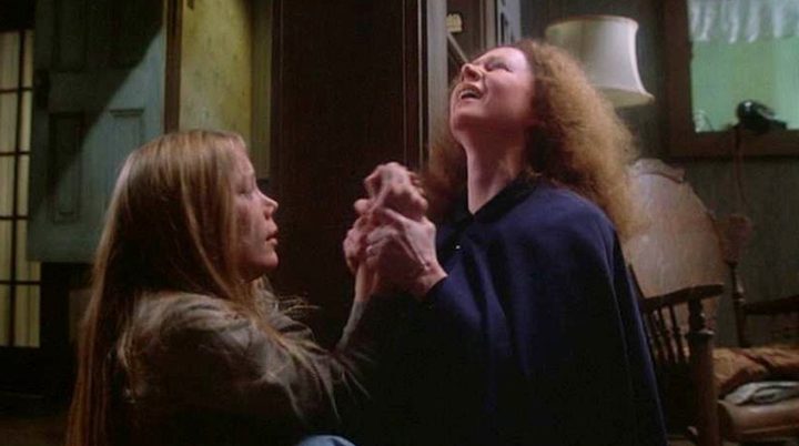 A daughter is held by her mom in Carrie.