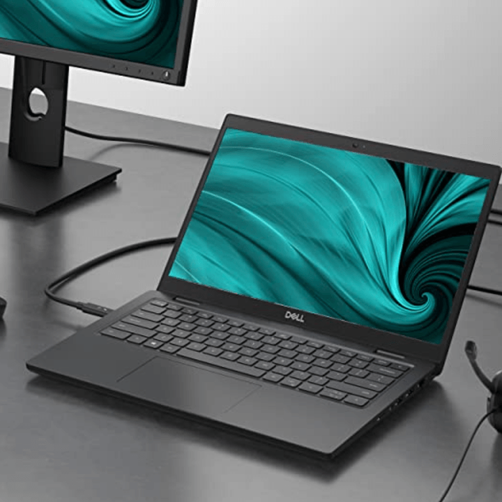 Dell Latitude 3420 on a desk hooked up to a monitor.