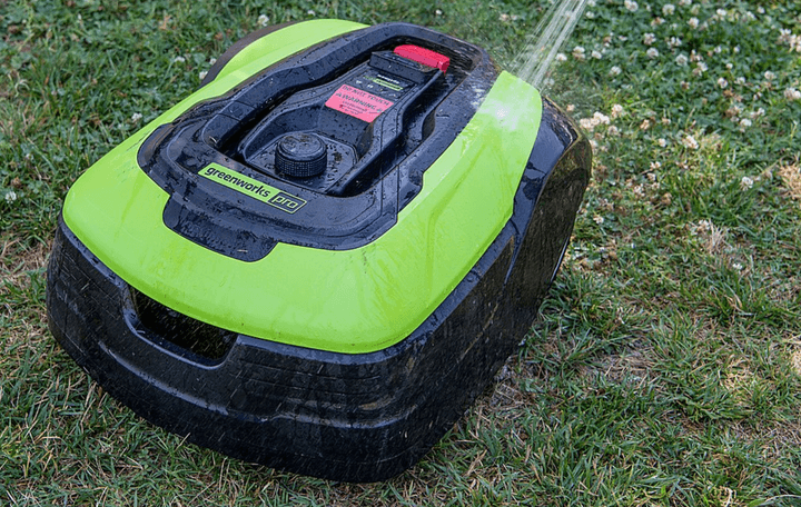 Rinsing off the Greenworks Optimow.