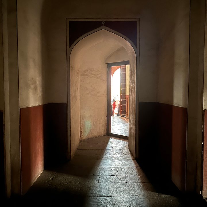 Dark alleyway inside a tomb captured by the iPhone 14 Pro.