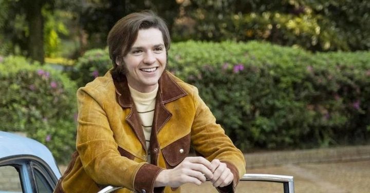 Joel Courtney smiles in Jesus Revolution.