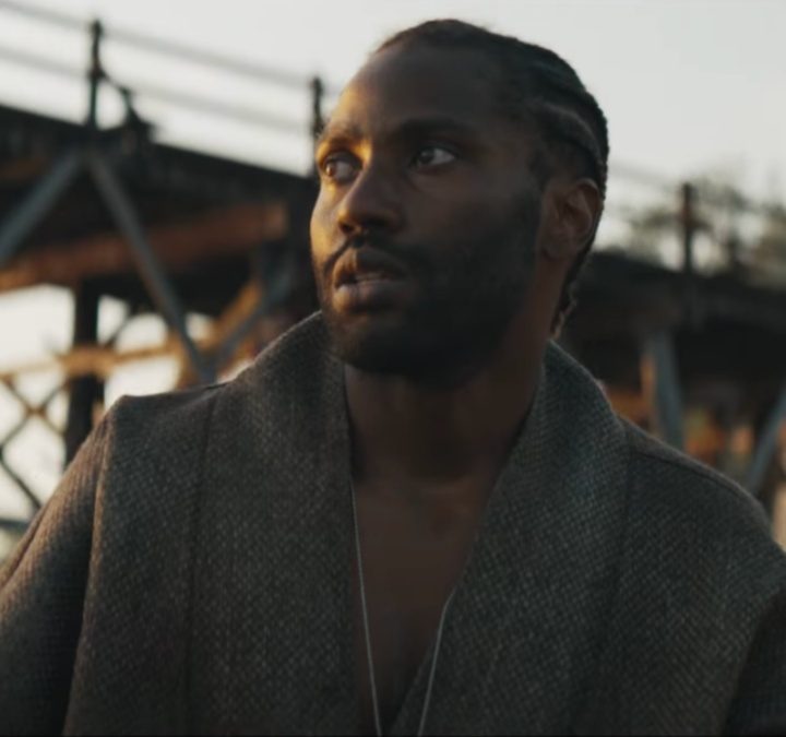 John David Washington stares in the distance in The Creator.