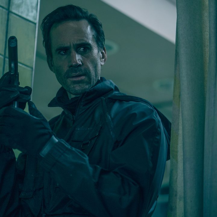 Joseph Fiennes holds a gun in The Mother.