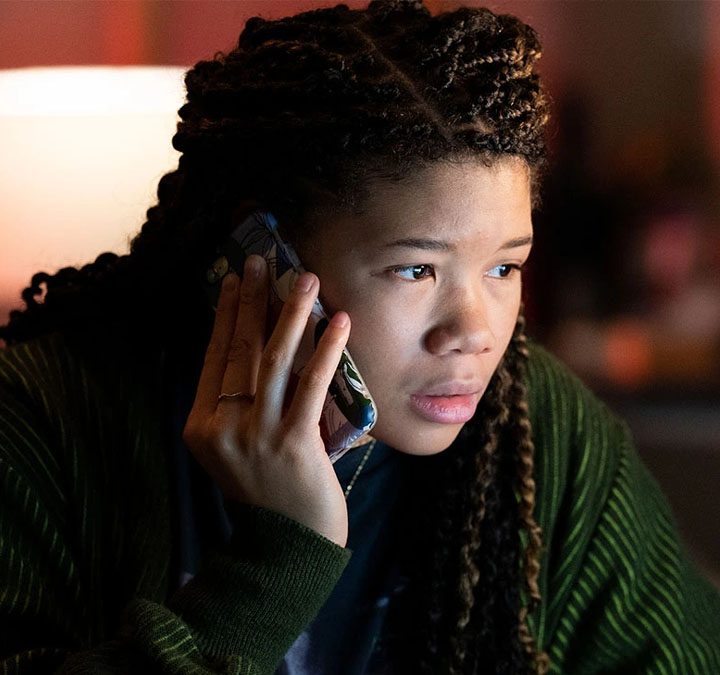 Storm Reid holds a phone to her head in Missing.