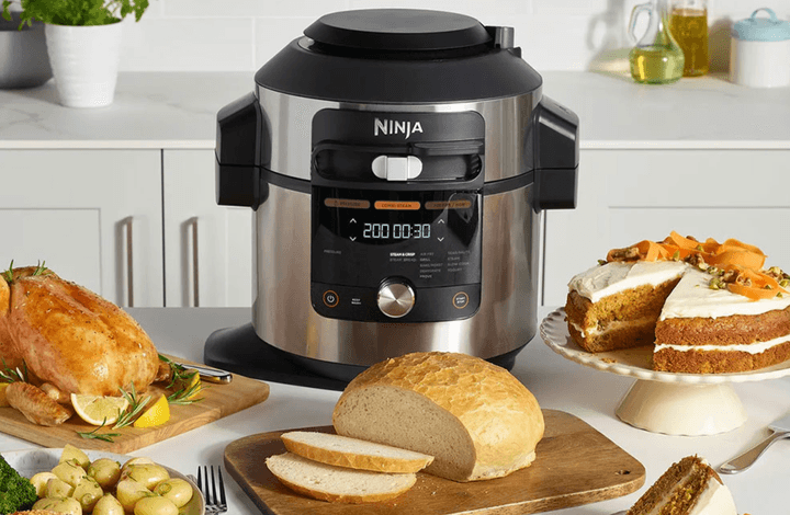 The Ninja Foodi 14-in-1 8-quart XL on a counter with a meal.