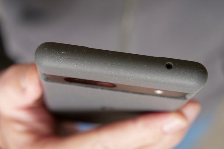 The top of the Pixel 7a's case, covered in lint.