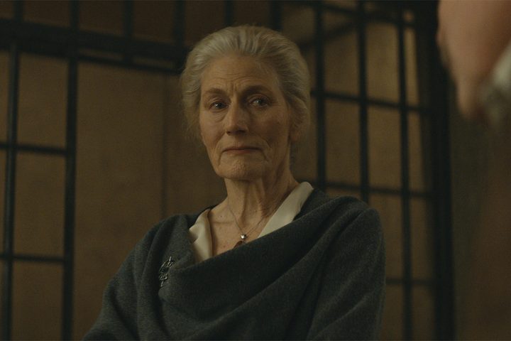 Ruth Jahns stands near a jail cell in Silo.