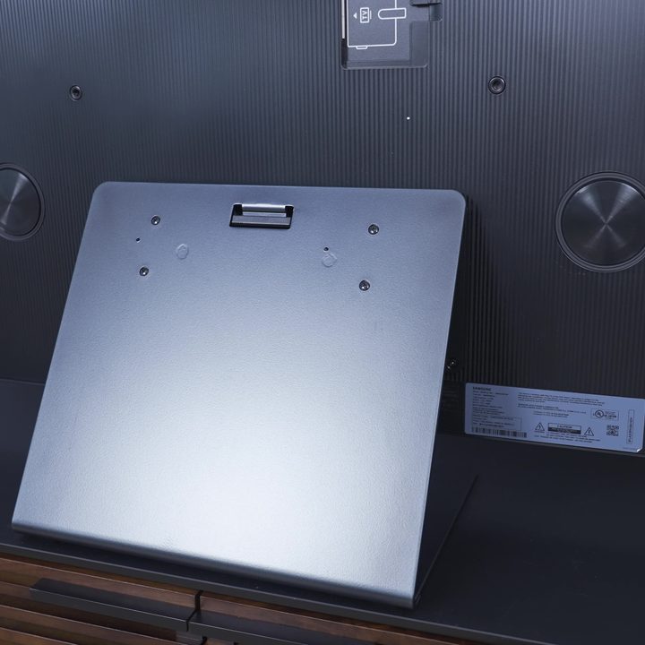 The pedestal stand of Samsung S95C OLED TV from the rear.