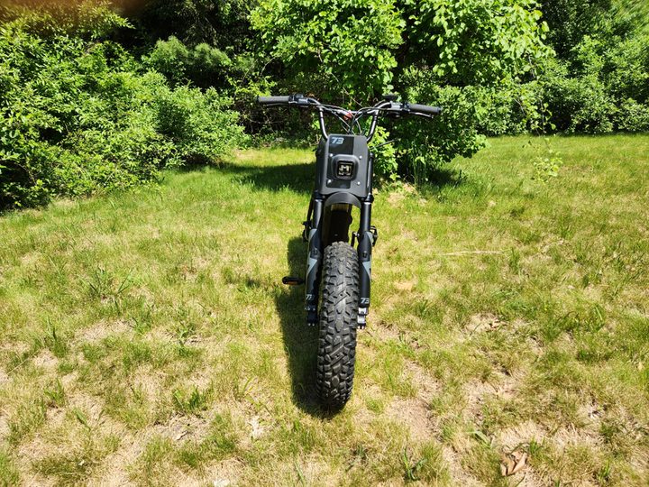 Super73-S Adventure frontal shot on grass has a commanding look.