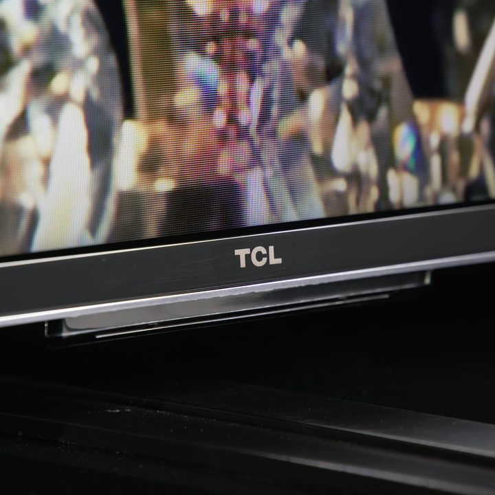 The base and logo on the TCL QM8 Mini-LED TV.