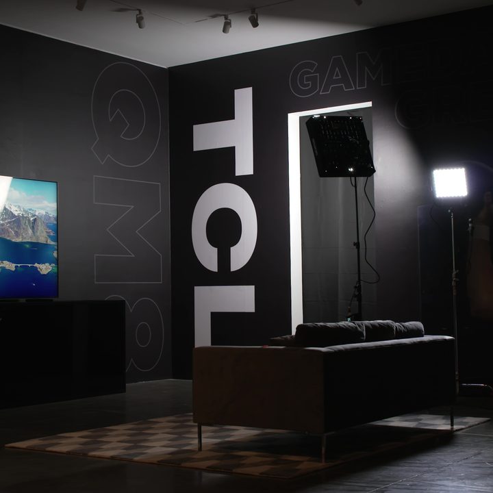 THe TCL QM8 Mini-LED TV in a TCL studio room.