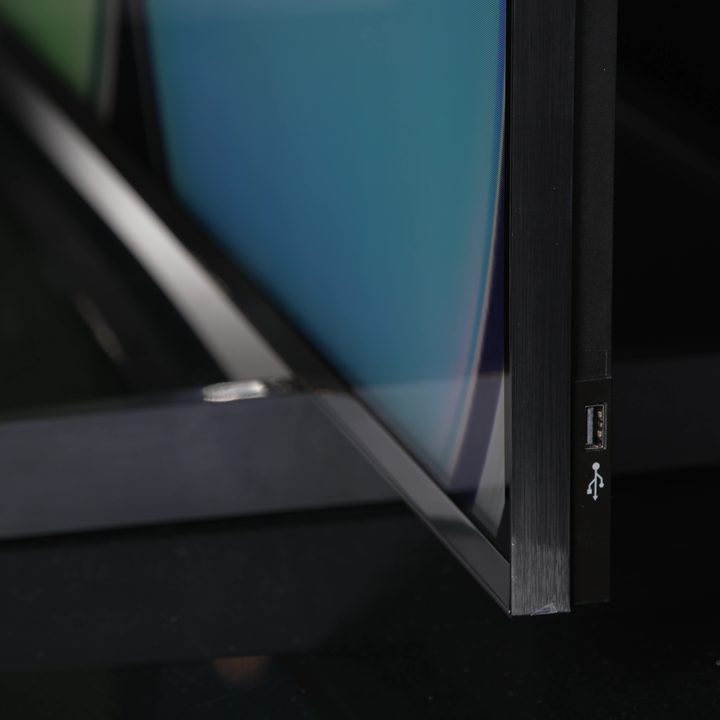 The bottom bezel and base of the TCL QM8 Mini-LED TV.