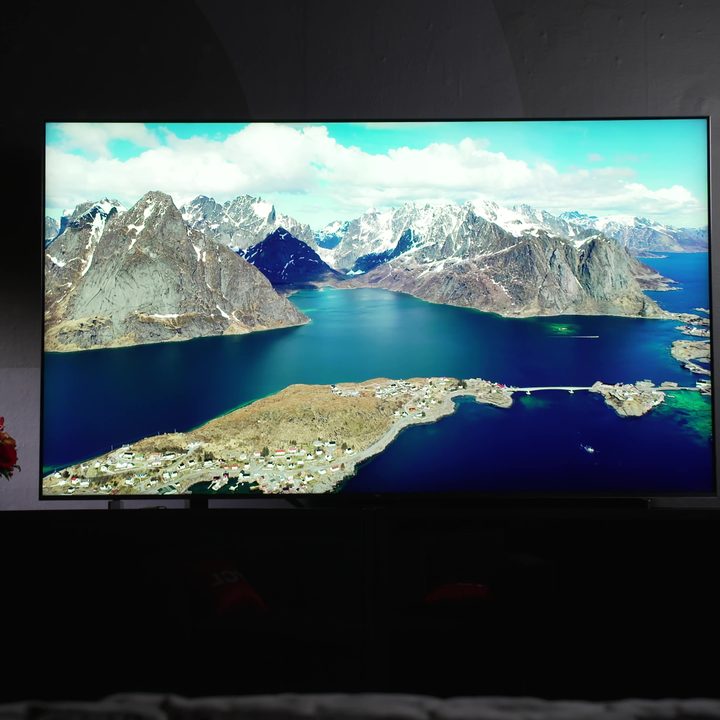 A fjord scene on the TCL QM8 Mini-LED TV in a darkened room.