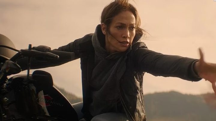 The Mother reaching for her daughter on a motorcycle