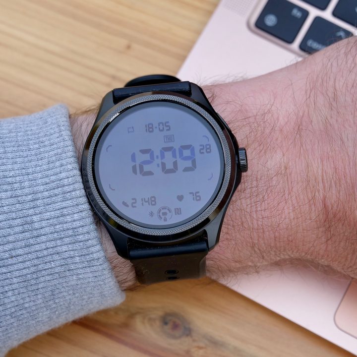 The Mobvoi TicWatch Pro 5 on a person's wrist, showing the secondary display.
