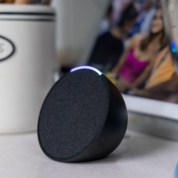 The Amazon Echo Pop on a desk.